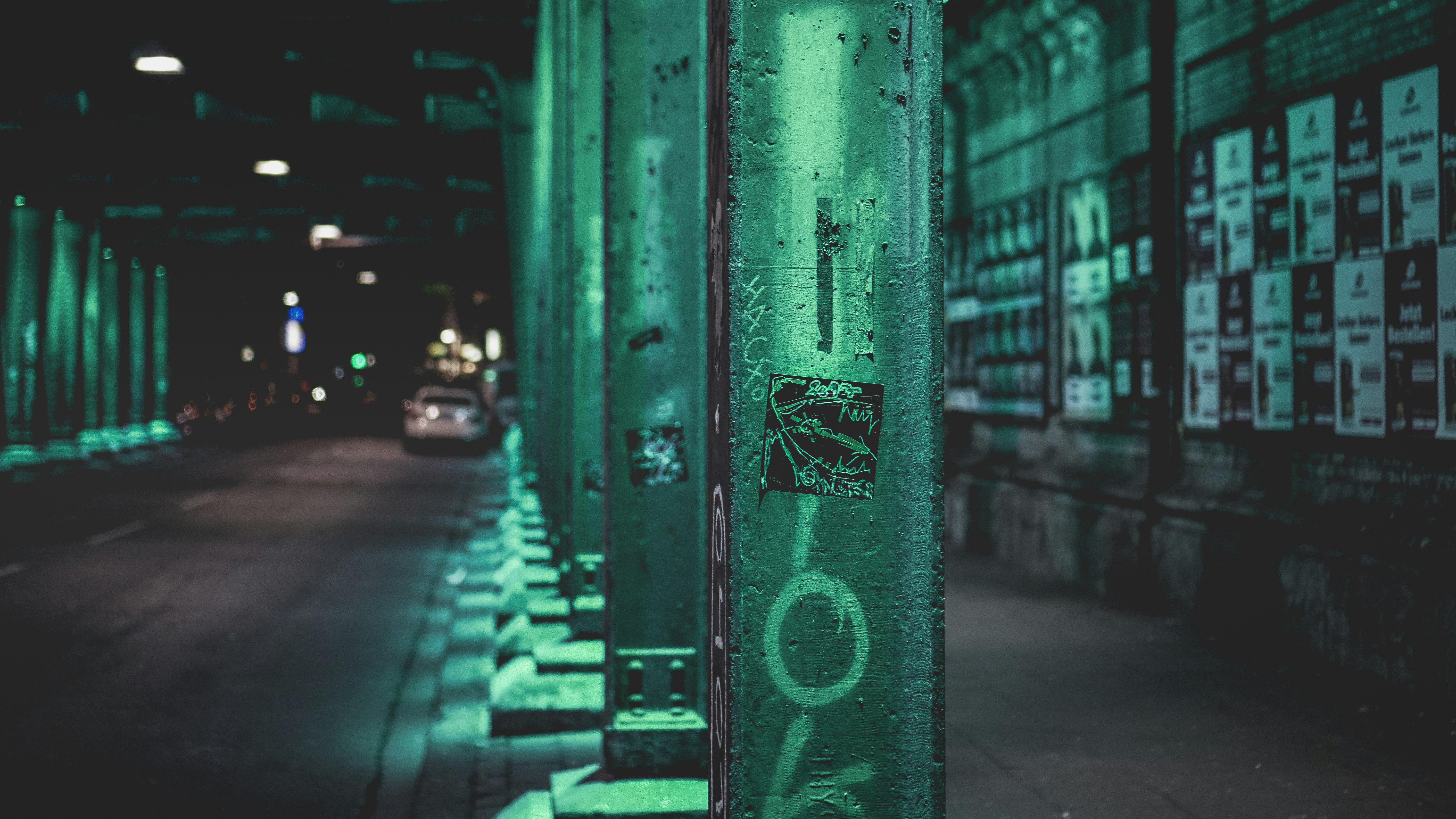 green steel fence near cars during daytime